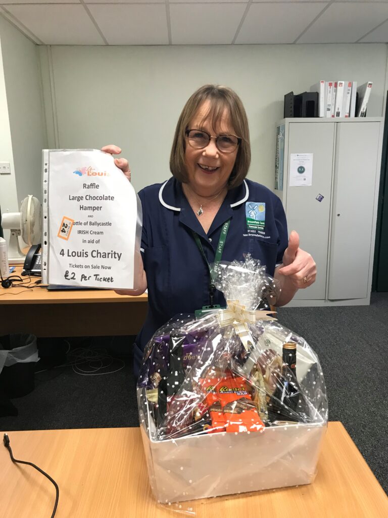 Jackie, one of our support workers at Broomfield Care, with the 4Louis prize hamper. 