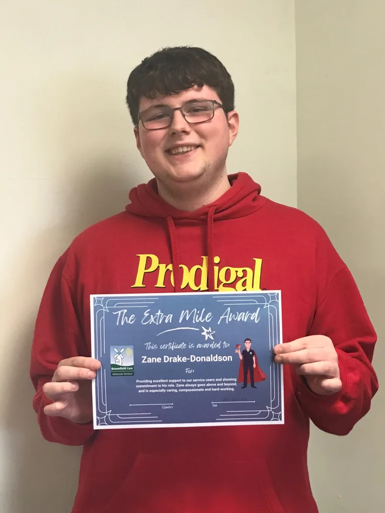 Zane with his extra mile award certificate
